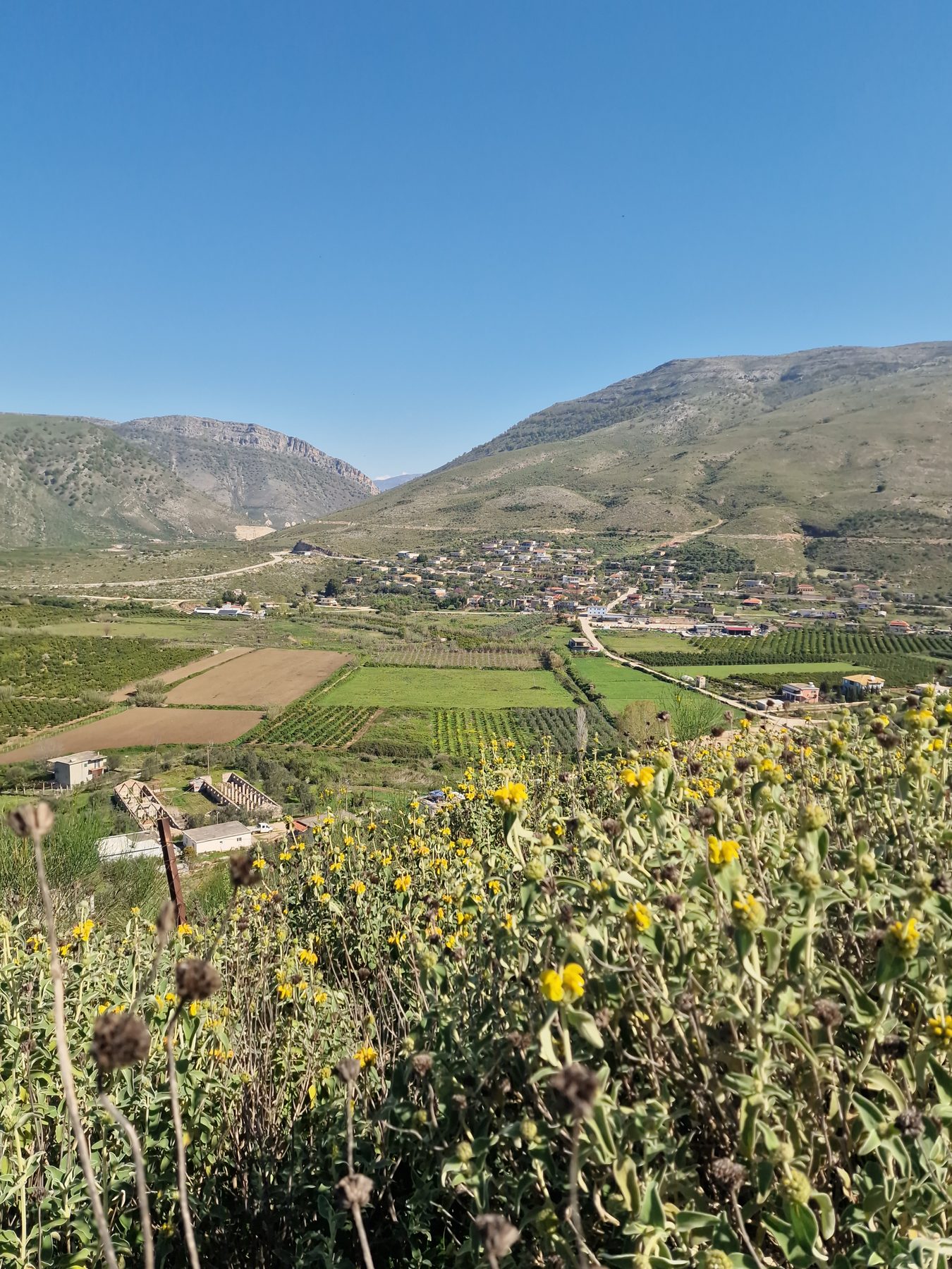 Patchwork fields and villages below the trail