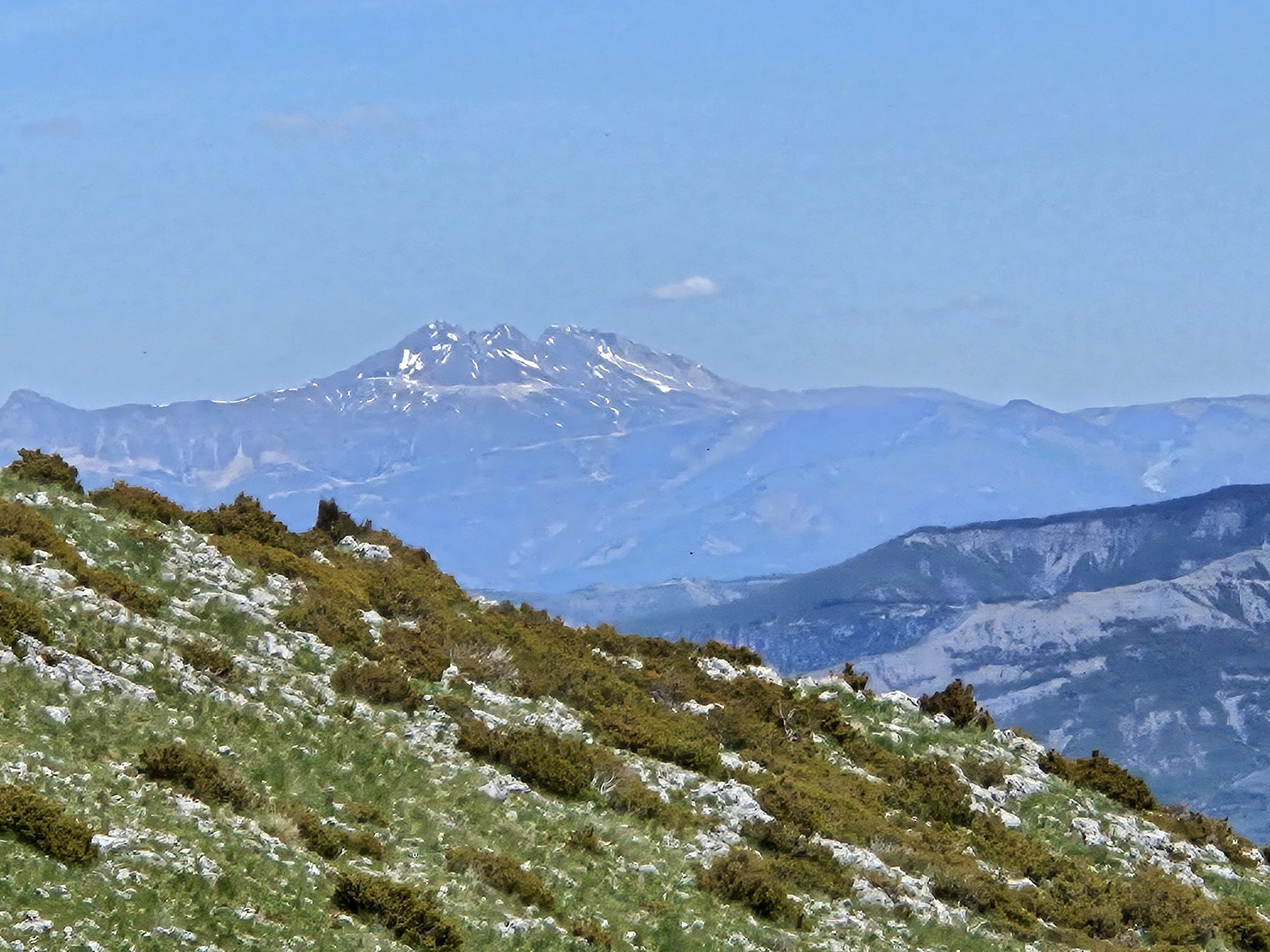 A snow-capped peak above the trail