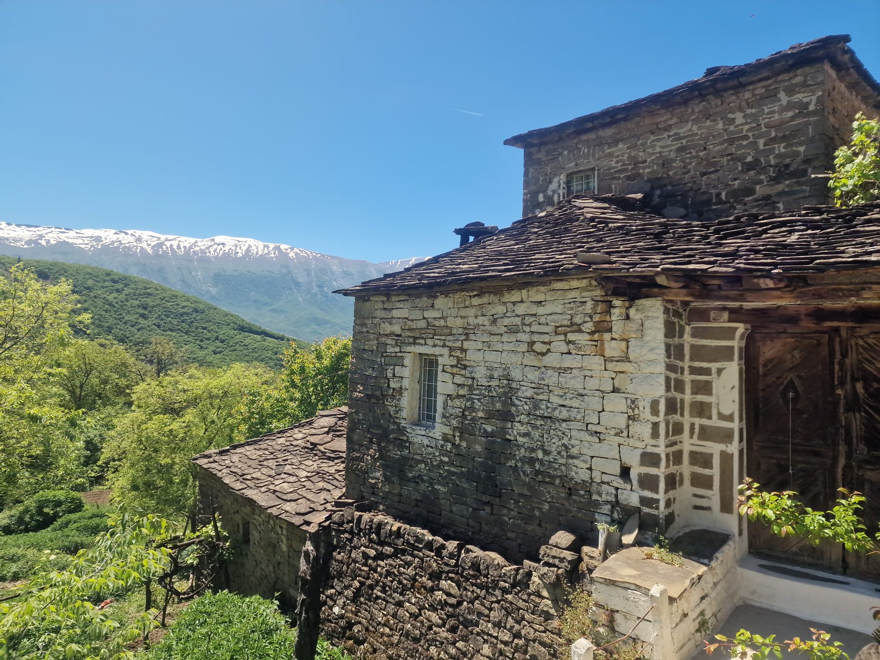 Village rooftops above the valley