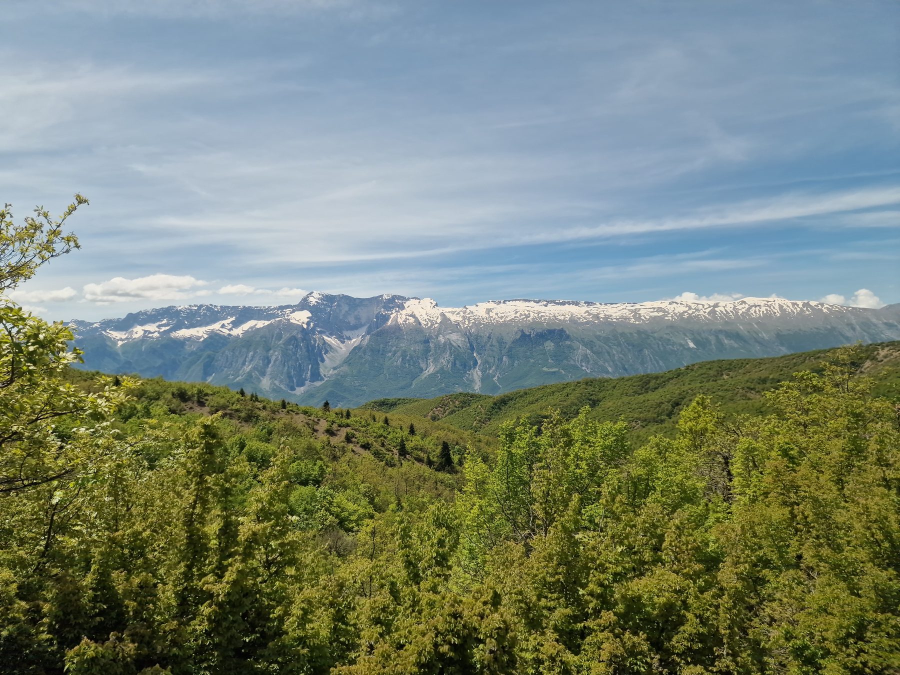 Snow-capped peaks above the trail near Delvinë